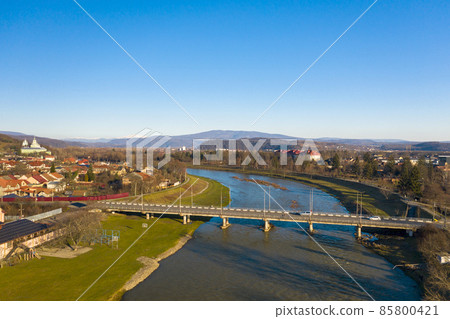 The Mukachevo city center at sunset time with beautiful mountains panorama aerial view 85800421