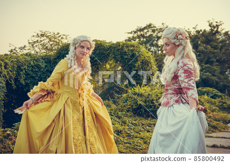 Portrait of two blonde woman dressed in historical Baroque clothes 85800492