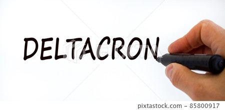 New covid-19 deltacron variant strain symbol. Doctor hand with black marker. The concept word Deltacron. Medical and COVID-19 deltacron variant strain concept. Copy space. 85800917