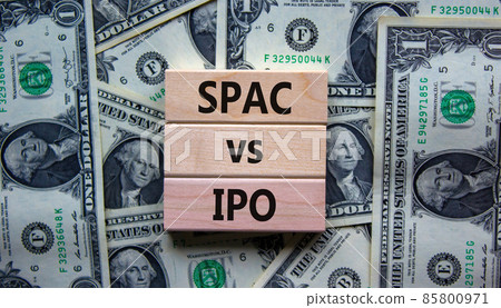 SPAC vs IPO symbol. Blocks with words 'SPAC, special purpose acquisition company' and 'IPO, initial public offering' on background from dollar bills, copy space. Business and SPAC vs IPO concept. SPAC vs IPO symbol. Blocks with words 'SPAC, special purpose acquisition company' and 'IPO, initial public offering' on background from dollar bills, copy space. Business and SPAC vs IPO concept. 85800971