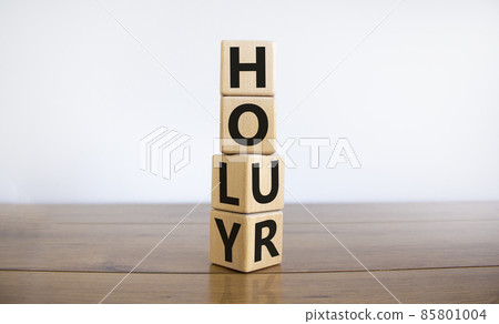 Holy hour symbol. Turned wooden cubes with words holy hour. Beautiful wooden table, white background, copy space. Religion and holy hour concept. 85801004