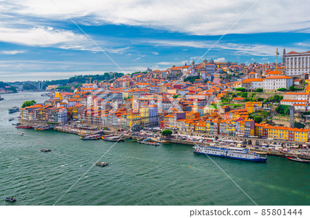 Aerial panoramic view of Porto Oporto city historical centre with Ribeira district colorful buildings houses on embankment of Douro River 85801444