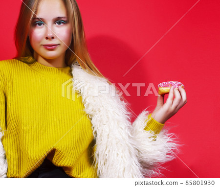 little cute blond teenage girl posing in fashion style with donut on red background, lifestyle people concept little cute blond teenage girl posing in fashion style with donut on red background, lifestyle people concept 85801930