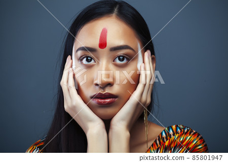 young pretty south asian girl posing in studio on grey background, lifestyle people concept 85801947
