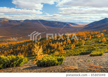 Beautiful autumn arctic landscape. View of the river valley among the mountains. Beautiful autumn arctic landscape. View of the river valley among the mountains. 85805049