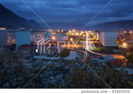 Beautiful night city landscape. Top view of the buildings and streets of a small Arctic port town 85805050