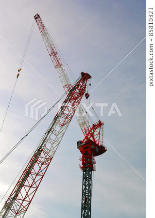 Giant crane working at a large-scale development construction site 85810321
