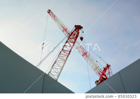 Giant crane working at a large-scale development construction site 85810323