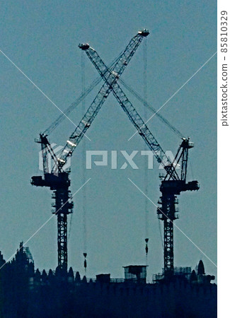 Giant crane working at a large-scale development construction site 85810329