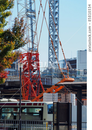 Giant crane working at a large-scale development construction site 85810334