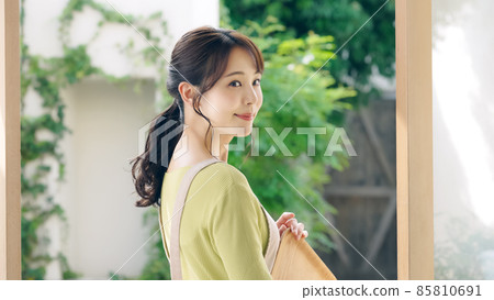 A female clerk standing in a lush store A female clerk standing in a lush store 85810691