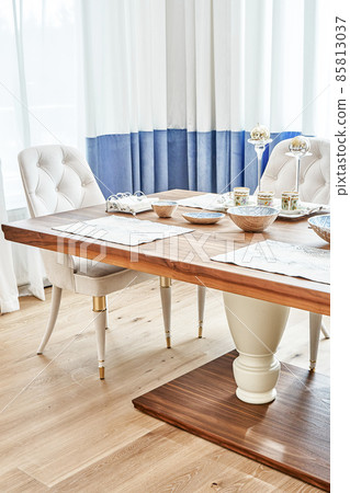 Dining table of walnut with festive setting and armchairs Dining table of walnut with festive setting and armchairs 85813037