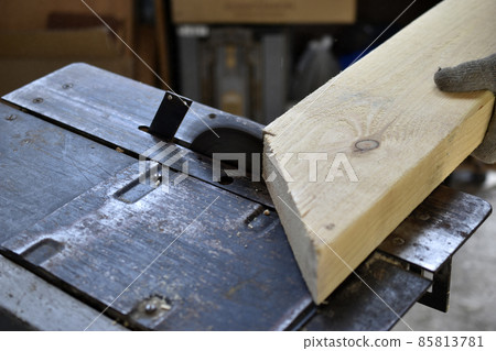Silver circular saw in the garage at work Silver circular saw in the garage at work 85813781