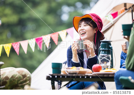 Woman enjoying camping Woman enjoying camping 85813878