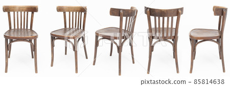 Set of wooden chairs from the turn of 70's and 80's from the previous century in dark brown color. Polish design and production. View from each side Set of wooden chairs from the turn of 70's and 80's from the previous century in dark brown color. Polish design and production. View from each side 85814638