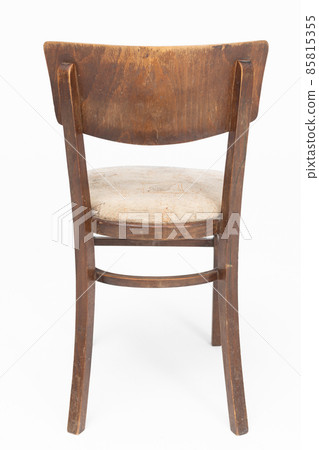 Wooden chair from turn of 70's and 80's from previous century with soft seat. Polish design and production. Rear view Wooden chair from turn of 70's and 80's from previous century with soft seat. Polish design and production. Rear view 85815355