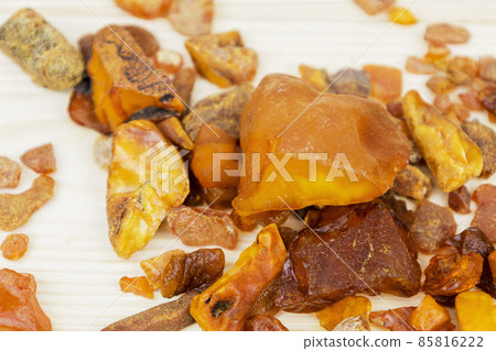 Amber. There are many different transparent pieces of amber, small and large, Ancient wood resin as a mineral for jewelers. The Sunstone 85816222