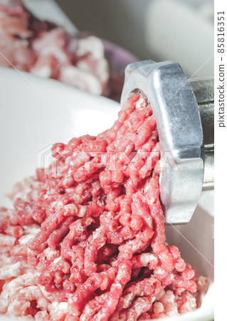 fresh minced meat from a meat grinder 85816351