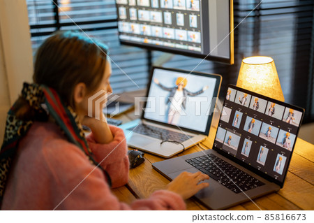 Photographer editing photos at home office 85816673