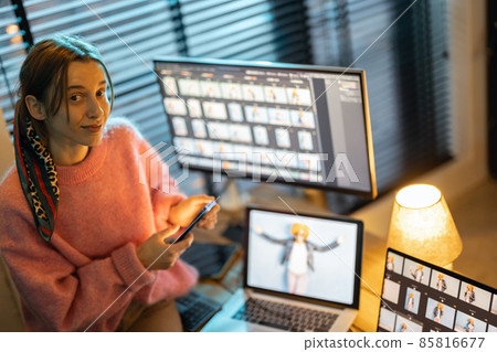 Photographer editing photos at home office 85816677