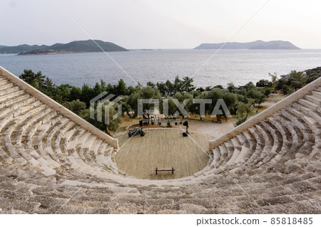 Ancient Greek amphitheater in Kas Turkey. Antique amphitheater by the sea. Antique sights. 85818485