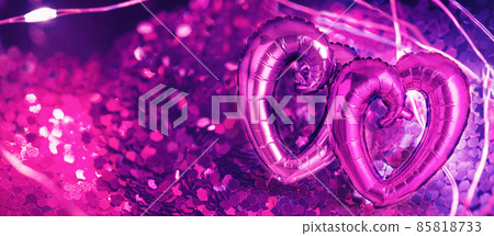 Two Foil Heart shaped balloons on pink 85818733