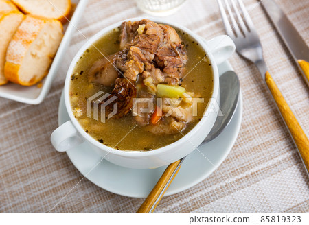 Mushroom nutritious soup with pork and other ingredients closeup 85819323