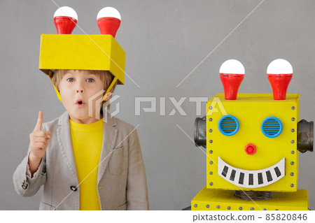 Happy child playing with robot Happy child playing with robot 85820846