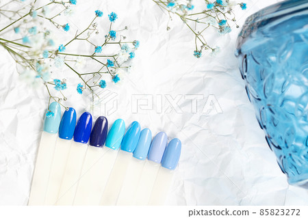 Different blue nails polish manicure palette Background. Different blue nails polish manicure palette Background. 85823272