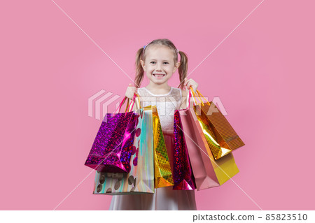 Cropped body photo of cute girl go shopping buy bargains wear in a party dress Cropped body photo of cute girl go shopping buy bargains wear in a party dress 85823510