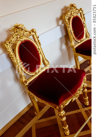 Red classical chairs in a room Red classical chairs in a room 85823751