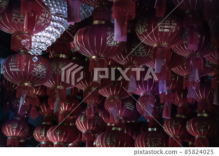 Many red Chinese lanterns in Interior at temple 85824025
