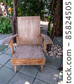 old hardwood in garden chair with tree. 85824505