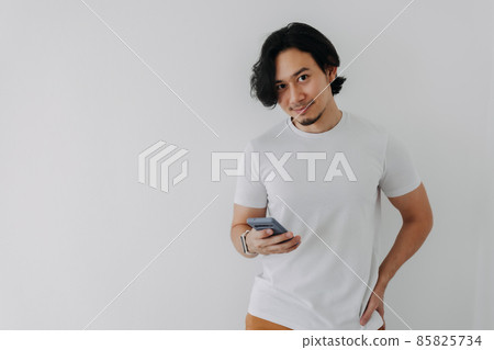 Happy man using smartphone on white background and copy space. 85825734