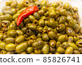 Green olive salad background with a chilli on top 85826741