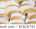 Delicious pastry with icing on top filling the scene 85826742