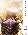 Chocolate cake with a treble clef sign made with cream 85826745