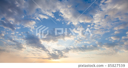 Blue morning sky with white fluffy clouds Blue morning sky with white fluffy clouds 85827539