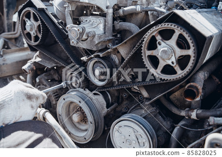 car engine disassembled at shallow depth of field 85828025