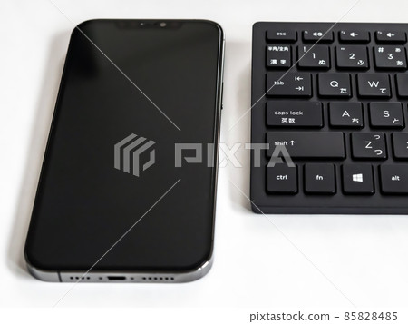 Smartphone and keyboard Smartphone and keyboard 85828485