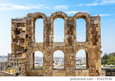 Ancient Greek ruins in Athens, Greece, Europe. Odeon of Herodes Atticus overlooking city. 85829590
