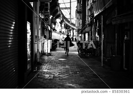 A woman running through the side of a candy 85830361