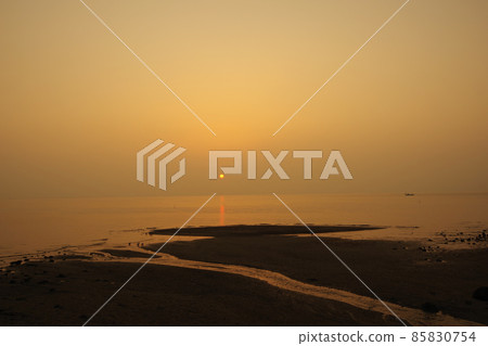 The hazy sky and the orange shining sun The hazy sky and the orange shining sun 85830754