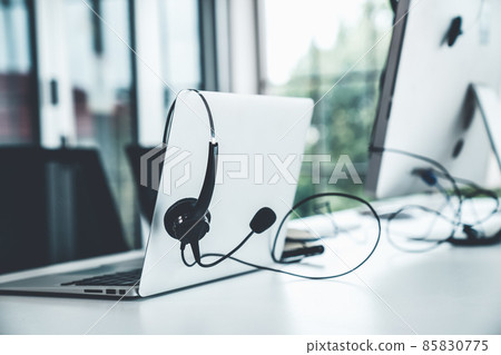 Headset and customer support equipment at call center ready for actively service Headset and customer support equipment at call center ready for actively service 85830775