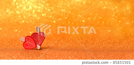 two hearts. valentine's day. on a golden sparkling background. 85831501