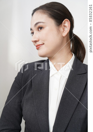 A woman in a suit 85832161