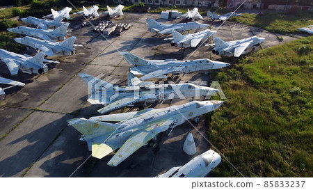 Aerial drone view flight over old rusty broken plane aircraft. 85833237