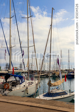 White yachts in the sea harbor of Kemer, Antalya province in Turkey. Kemer Marina on the Mediterranean sea White yachts in the sea harbor of Kemer, Antalya province in Turkey. Kemer Marina on the Mediterranean sea 85834526