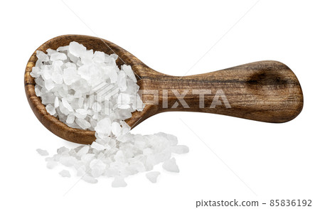 sea salt in wooden spoon and pile near isolated on white 85836192