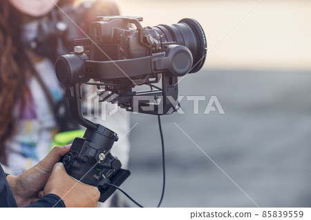 Motorized Gimbal, people using digital camera with anti shake for video production scene stabilizer 85839559